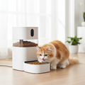Cat eating from smart pet feeder